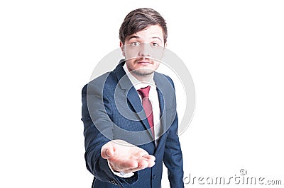 Sales man making begging gesture with one hand Stock Photo