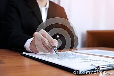 Sales manager giving advice application form document, considering mortgage loan offer for car and house insurance Stock Photo