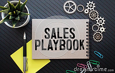 sales playbook on notepad with pen, glasses and calculator Stock Photo