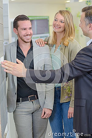 Sales rep with couple Stock Photo