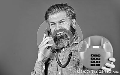 Sales script. Bearded man phone conversation. Retro phone. Outdated technology. Manager phone dialog communication. Call Stock Photo