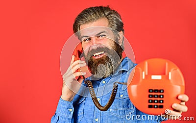 Sales script. Bearded man phone conversation. Retro phone. Outdated technology. Manager phone dialog communication. Call Stock Photo