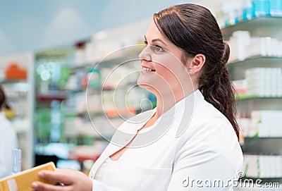 Sales woman in pharmacy or drug store Stock Photo