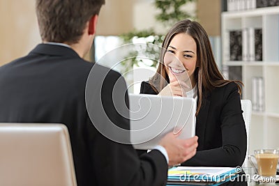 Salesman showing product to a client Stock Photo