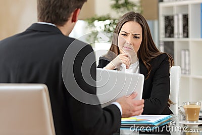 Salesman trying to convince a doubtful customer Stock Photo