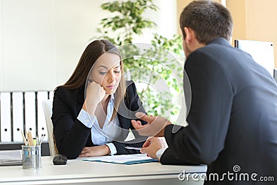 Salesman trying to convince to a bored client Stock Photo