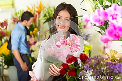 Saleswoman and customer in flower shop Stock Photo