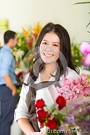 Saleswoman and customer in flower shop Stock Photo