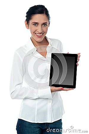 Saleswoman displaying new touch pad device Stock Photo