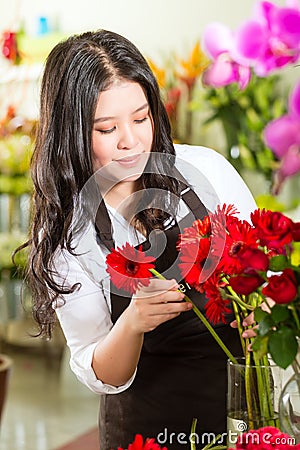 Saleswoman in a flower shop Stock Photo