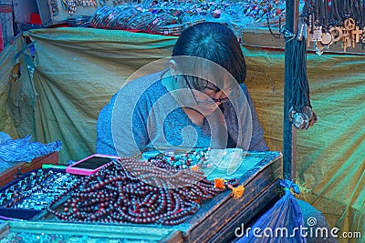 saleswoman of jewelry and amulets Editorial Stock Photo