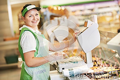 Saleswoman in supermarket shop Stock Photo