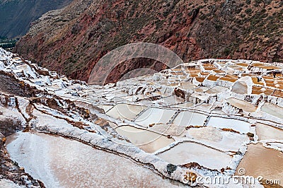 Salinas de Maras,Peru . Salt natural mine. Inca Salt pans at Maras, near Cuzco in Sacred Valley, Peru. Panoramic view. Stock Photo