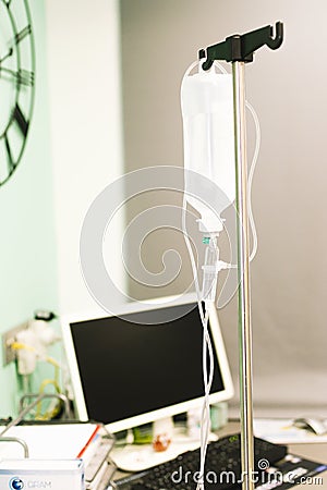 Saline droper hung on a hook in a clinic Stock Photo