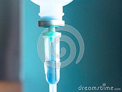 saline IV drip for patient and Infusion pump in hospital Stock Photo