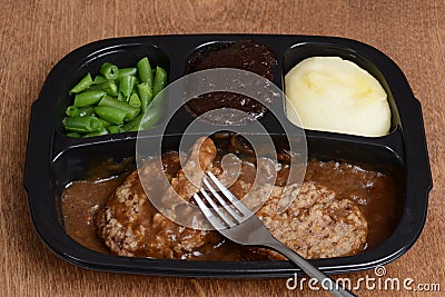 Salisbury steak tv dinner with a fork Stock Photo