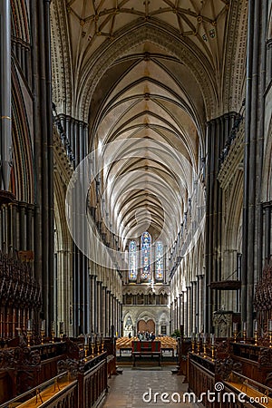 View of the choir and the central nave inside the historic Salisbury Cathedral Editorial Stock Photo