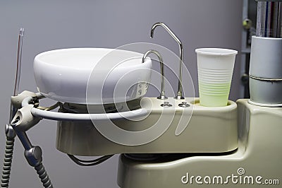 Salivary ejector and the reservoir for spitting in dental clinic Stock Photo