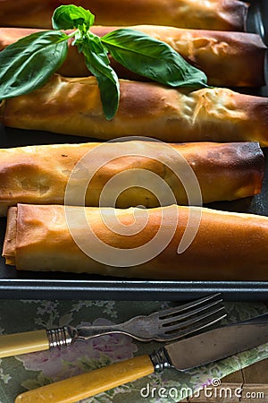 Salmon and basil butter filo parcels Stock Photo