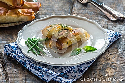 Salmon and basil butter filo parcels Stock Photo