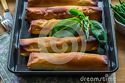 Salmon and basil butter filo parcels Stock Photo