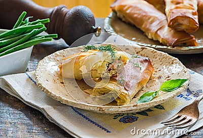 Salmon and basil butter filo parcels Stock Photo