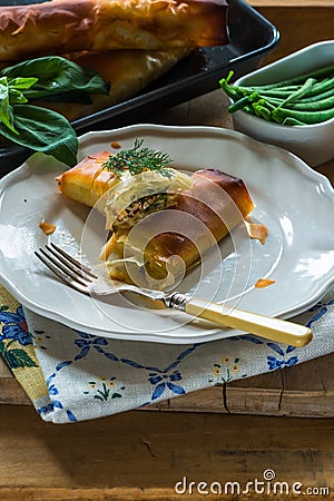 Salmon and basil butter filo parcels Stock Photo