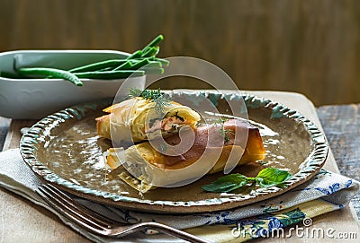 Salmon and basil butter filo parcels Stock Photo