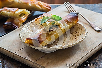 Salmon and basil butter filo parcels Stock Photo