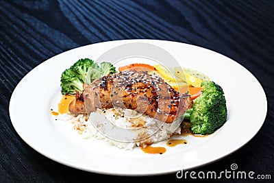 Salmon with broccoli, squash and steam rice. Stock Photo