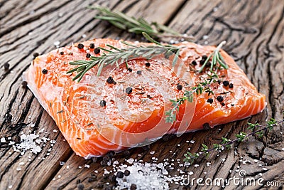 Salmon filet on a wooden carving board. Stock Photo