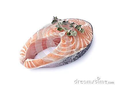 Salmon fish on white background with fresh oregano. Steak with spice isolated Stock Photo