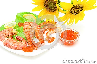 Salmon grilled steak, grilled shrimp and red caviar on a white b Stock Photo