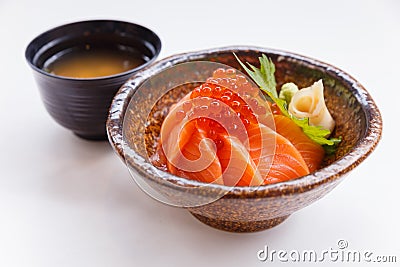 Salmon Ikura Don : Japanese Steamed Rice Topping with Raw Salmon and Tobiko Served with Wasabi and Prickled Ginger Stock Photo