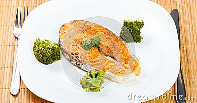 Salmon meat with delicious broccoli on white plate Stock Photo