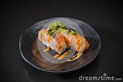 Salmon Nigiri, Sushi salmon burned and topped with Shrimp Eggs Stock Photo