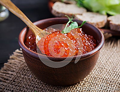 Salmon red caviar in bowl. Delicious food Stock Photo