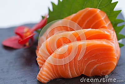 Salmon Sashimi : Sliced Raw Salmon Served with Sliced Radish on Stone Plate Stock Photo