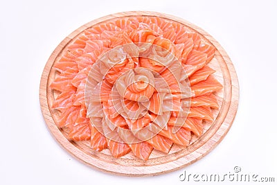 Salmon slides on wooden plate Stock Photo