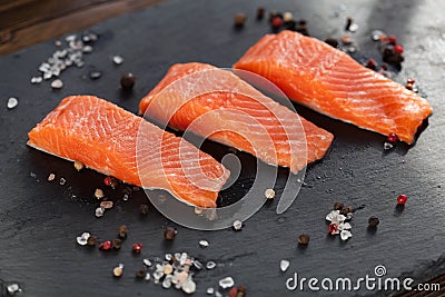 salmon steakes with pepper and salt grains Stock Photo