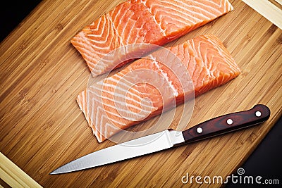 Salmon steaks on wooden board Stock Photo