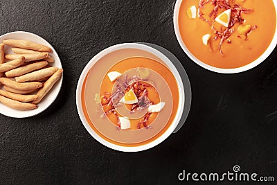 Salmorejo, Spanish cold tomato soup, overhead shot on a black background Stock Photo