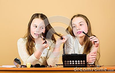 Salon and beauty treatment. Just like playing with makeup. Children little girls choose cosmetics. Makeup store Stock Photo