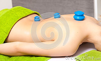 Salon. Woman getting spa cupping vacuum massage Stock Photo