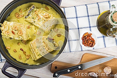 Salt cod in a pilpil sauce Stock Photo