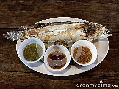 Salt Crusted Grill Fish With Three Thai Style Sauce Stock Photo