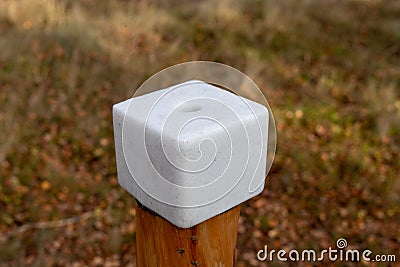 A salt cube prepared for forest animals. Lick in the forest near Stock Photo