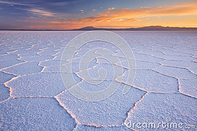 Salt flat Salar de Uyuni in Bolivia at sunrise Stock Photo