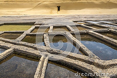 Salt pans located near Qbajjar on the maltese Island of Gozo. Detailed view on pans Stock Photo