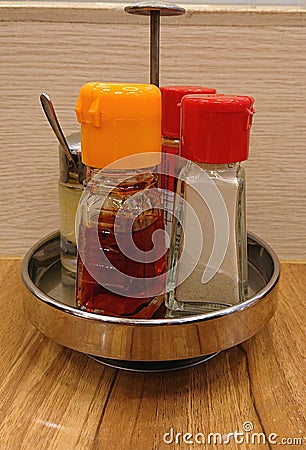 Salt, Pepper and Chili Sauce Editorial Stock Photo